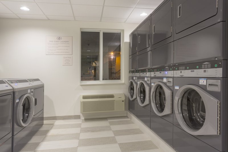Laundry Facility with Folding Table at Candlewood Miami