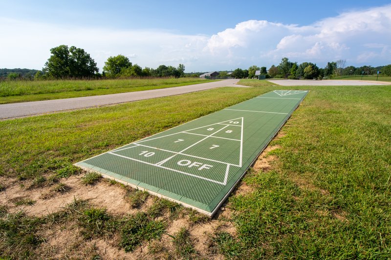 Play a game of shuffleboard outside