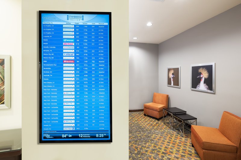 Review the status of your flight from the comfort of our lobby!
