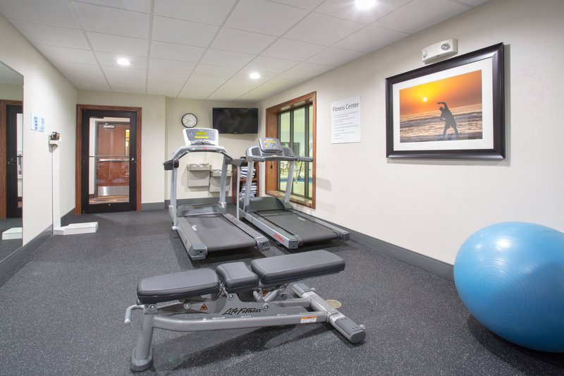 24 hour fitness center with yoga ball, weight bench, and more.