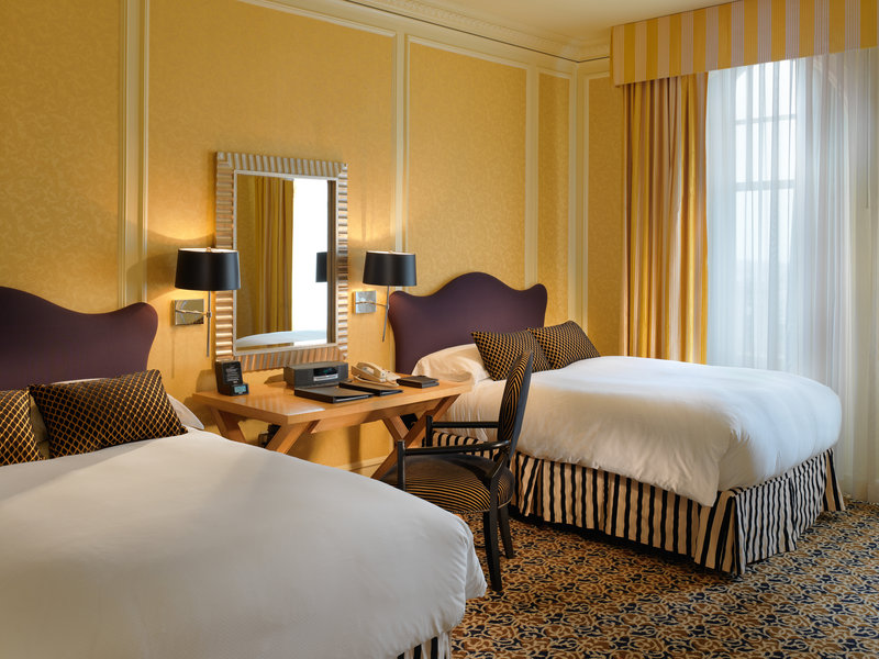 A second bedroom in the California Suite with 2 double beds